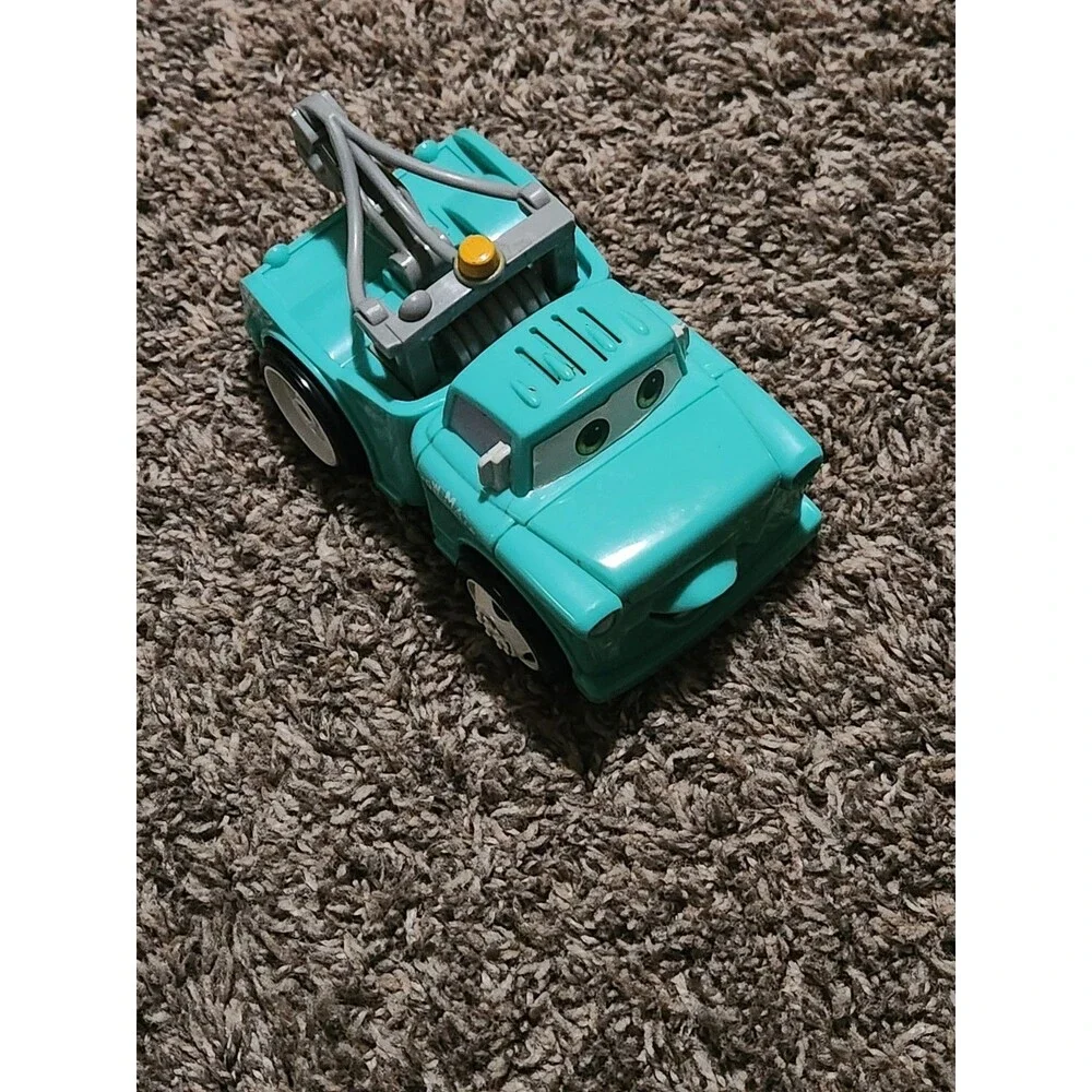 2005 Disney Pixar Cars Shake N Go Dinoco blue Tow-Mater, only rolls